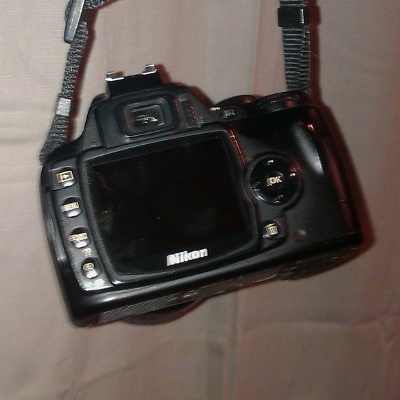 Nikon D40 DSLR Camera hanging by straps